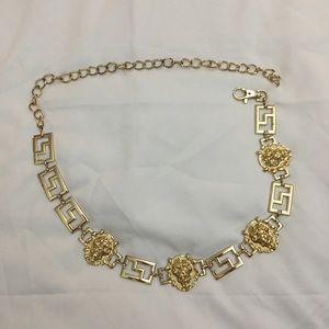 Gold tone metal waist belt with lions